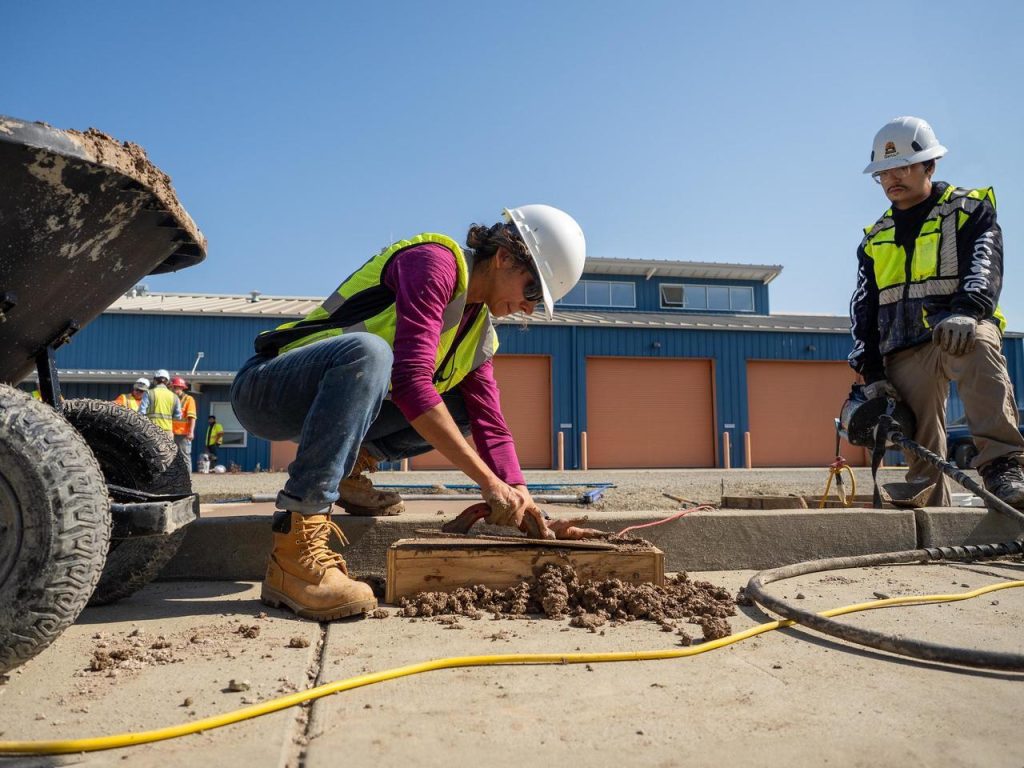 Researchers working on a test slab