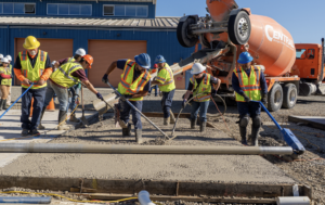 Research engineers and industry partners work together to create test slabs at UCPRC.